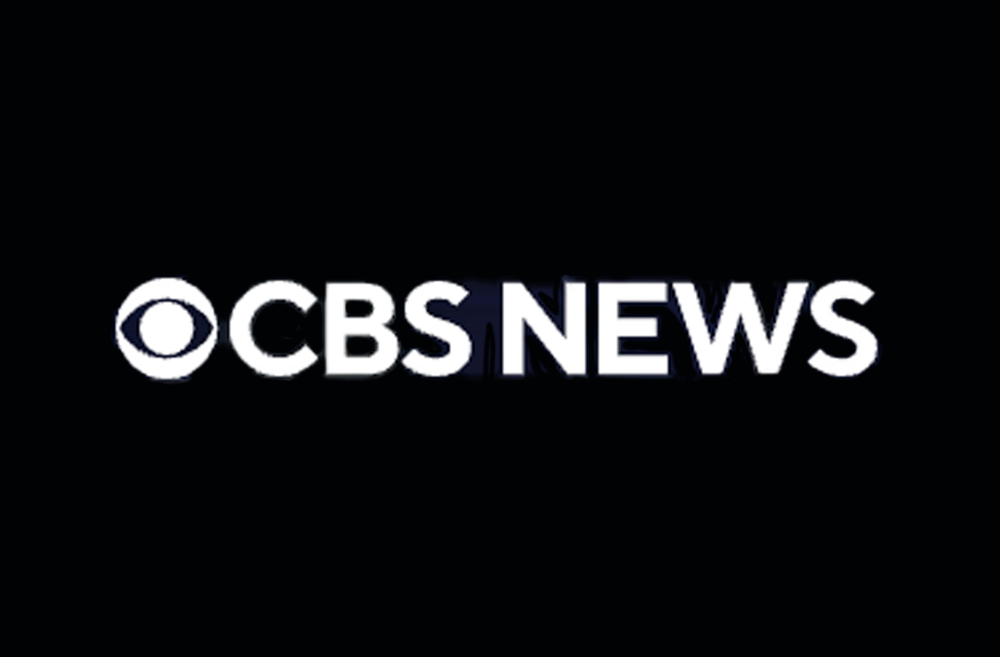 CBS News logo, a white circle with an eye in it, followed by the text CBS News in white sans serif font on a black background.