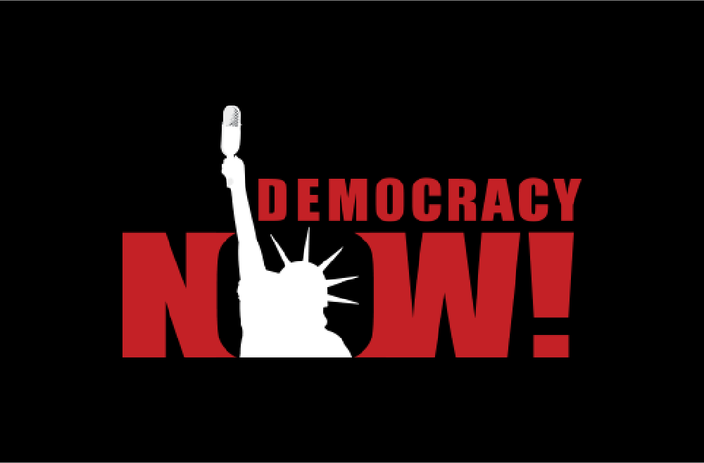 Democracy Now! logo, in a red sans serif font with the top part of the Statue of Liberty in white in place of the letter O in Now.