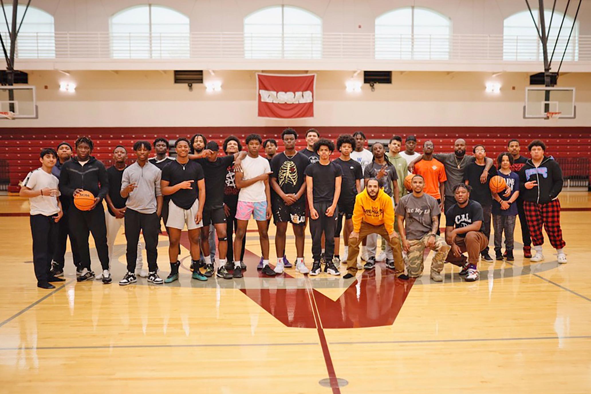 A group shot from The Brothers@ outing on the basketball court at the Vassar Athletics and Fitness Center.