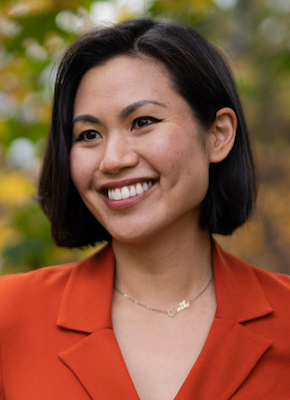 A headshot of Catherine Tan, a person with long black hair and a red shirt.