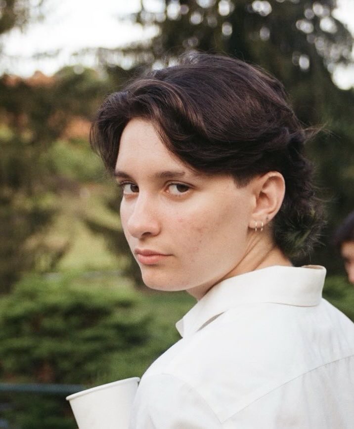 Headshot of Foster Schrader with black hair and a white shirt.