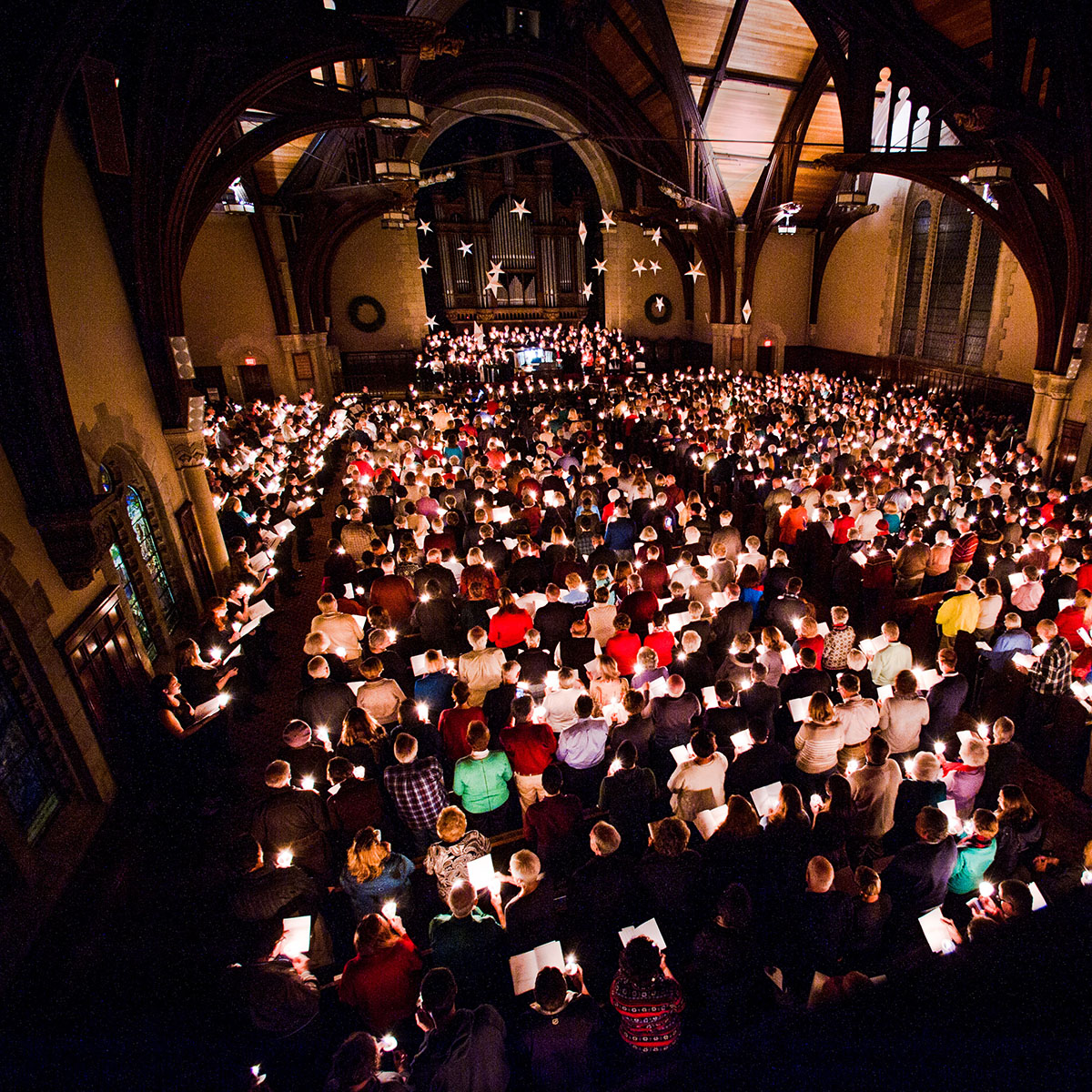 Pictured from above, the interior of the Vassar chapel with people sitting.