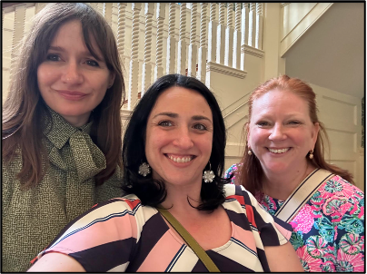 Three people smiling for a photo.