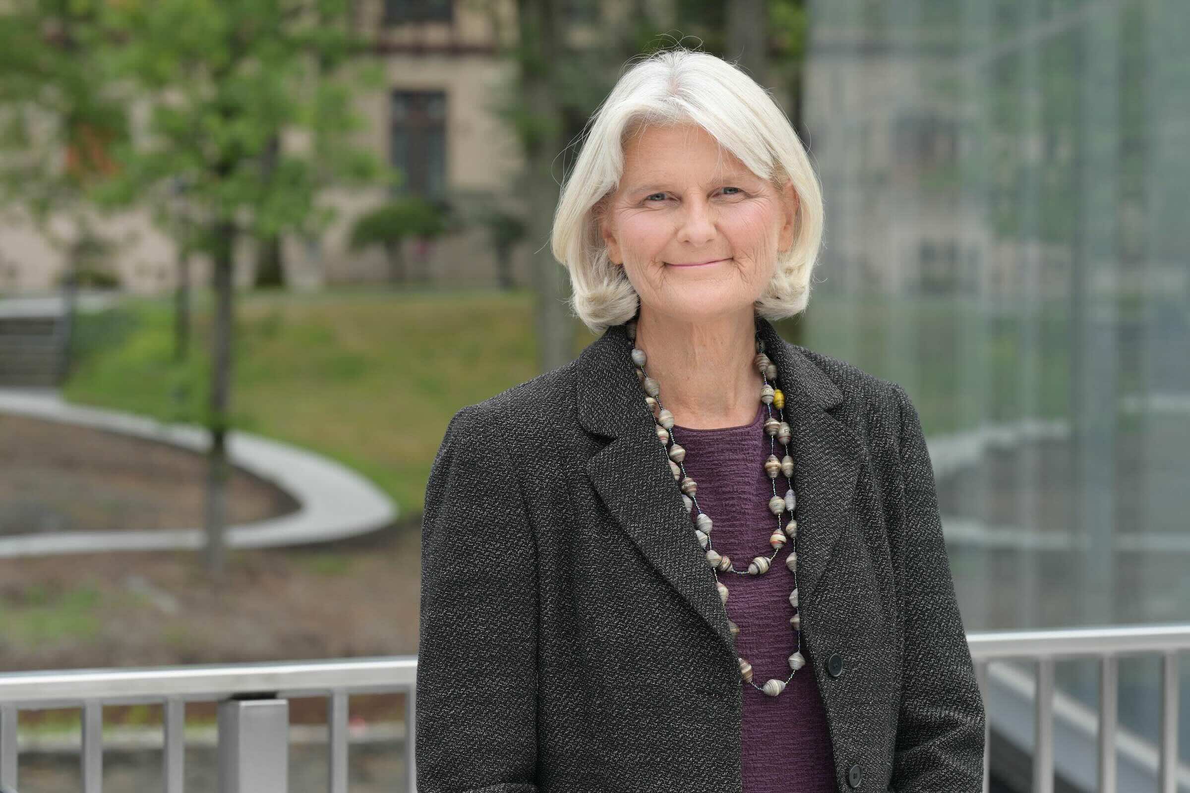 Photo portrait of Vassar president Elizabeth Bradley standing outside.