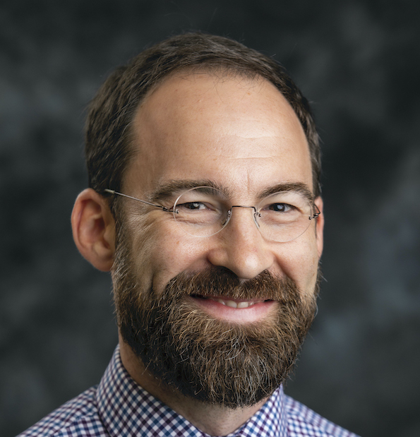 Photo portrait of Caleb Elfenbein.