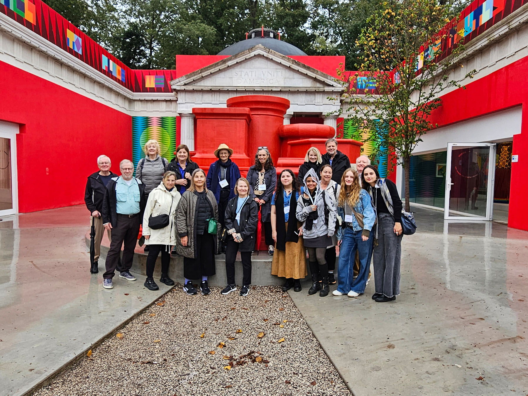 A group of people standing in a pavilion.