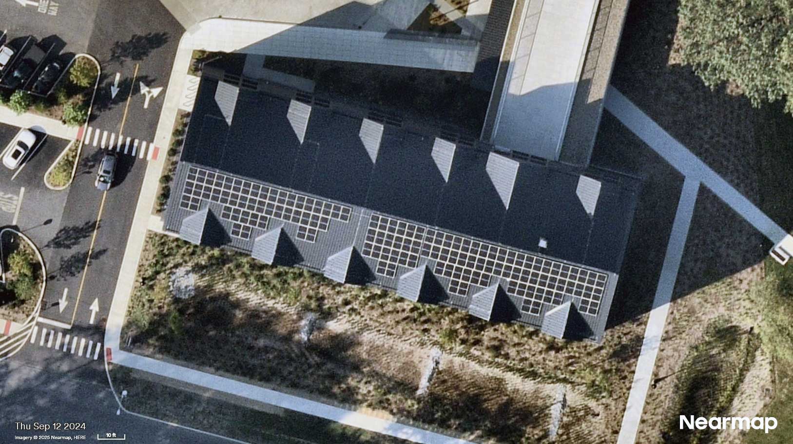 Aerial view of a roof with solar panels.