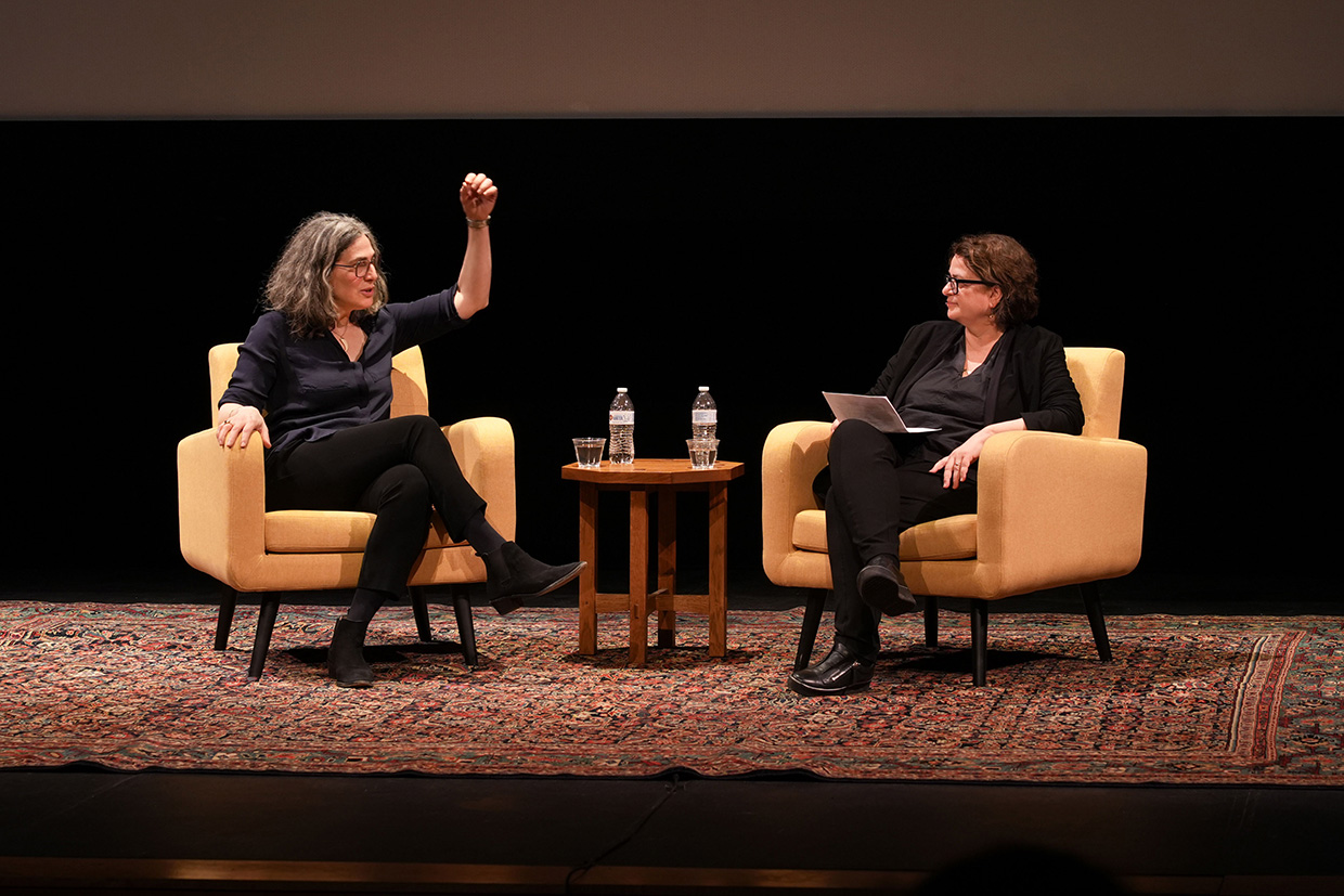 The subjects on stage, seated and in conversation