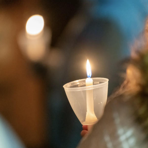 A photo of a lit candle.
