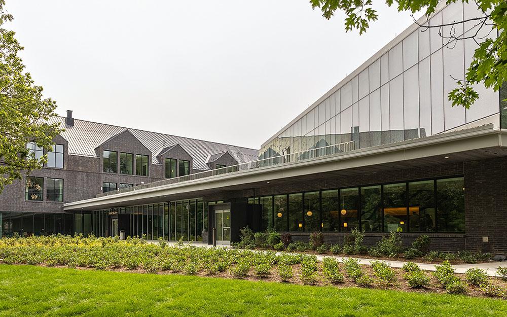 Exterior shot of a glass and metal building with large windows.