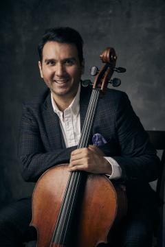 Yves Dhar poses with his cello.