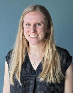 Marisa Peczuh wearing a black and white polka dot shirt and has long blonde hair.