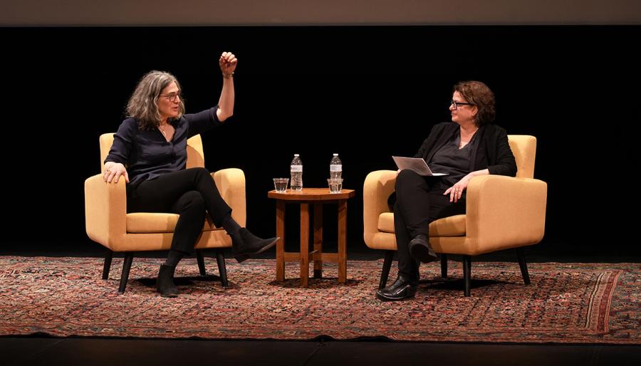 The subjects on stage, seated and in conversation