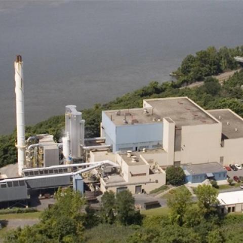 An overhead view of the Dutchess County incinerator, train tracks, and the Hudson River.