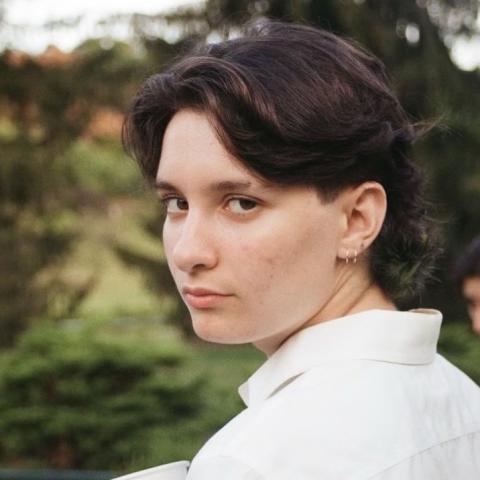 Headshot of Foster Schrader with black hair and a white shirt.