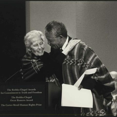 Historic photo of Dominique de Menil and Nelson Mandela at a podium